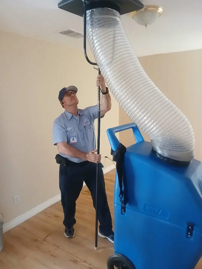 Furnace Tune-Up technician using HEPA equipment in Blacklick Estates